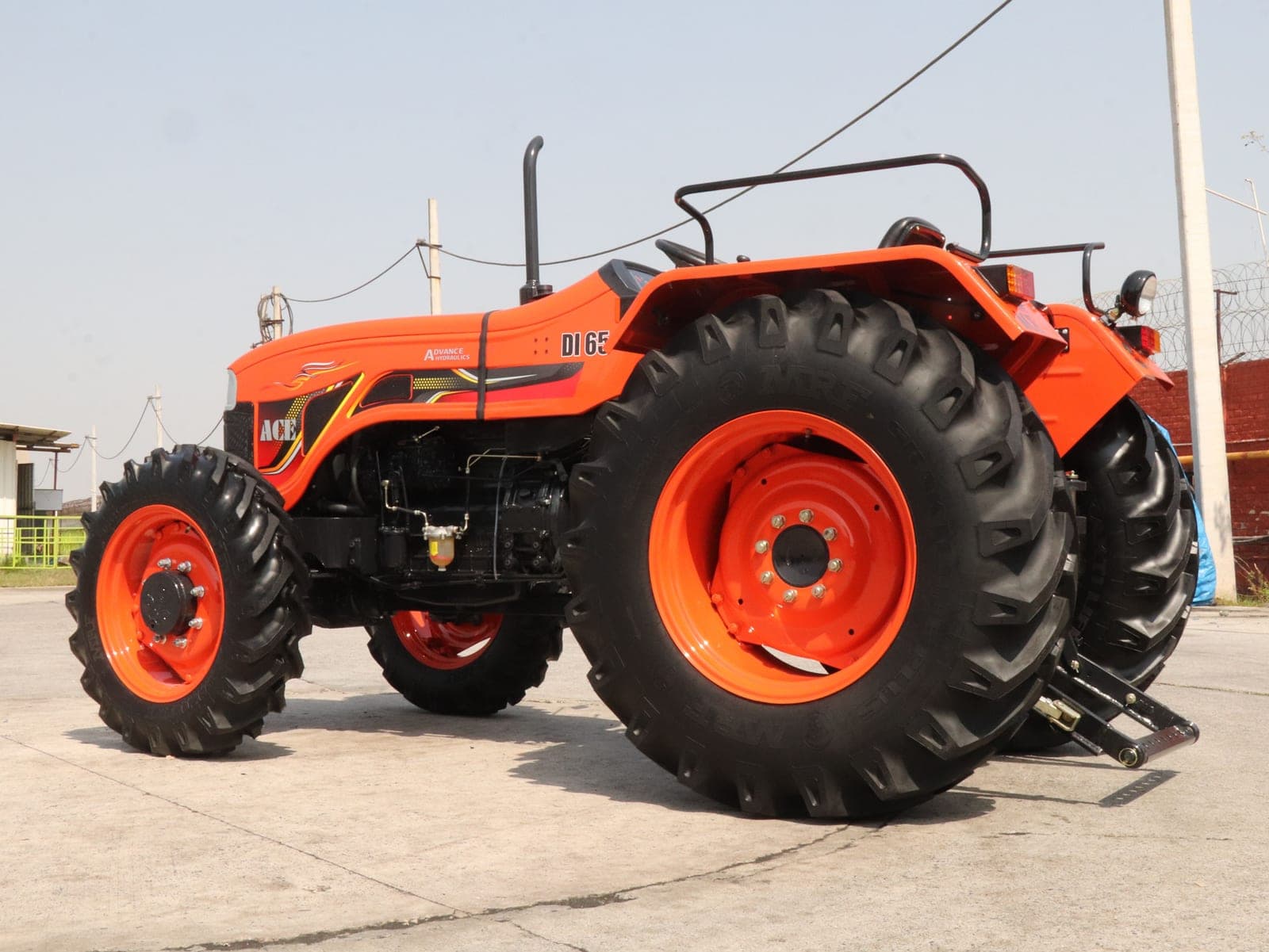 Orange compact farm tractor parked outdoors