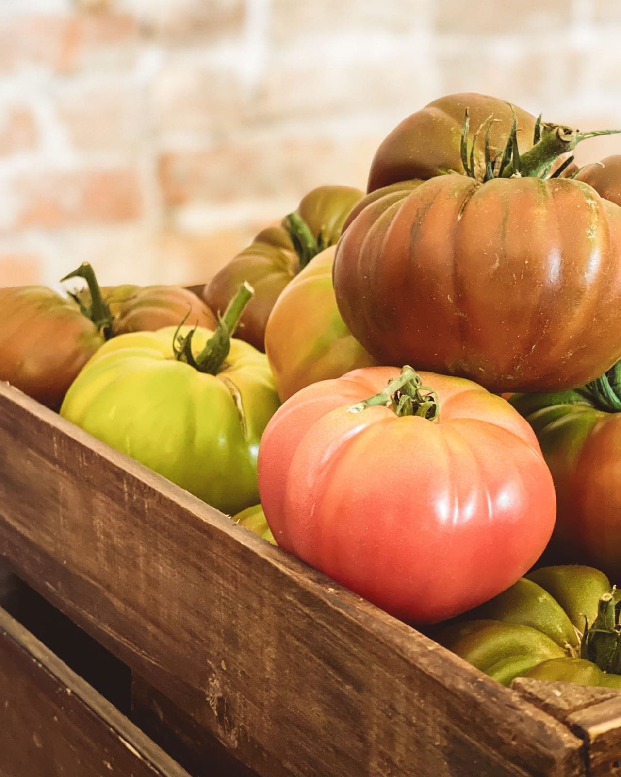 Crate of freshly picked heirloom tomatoes